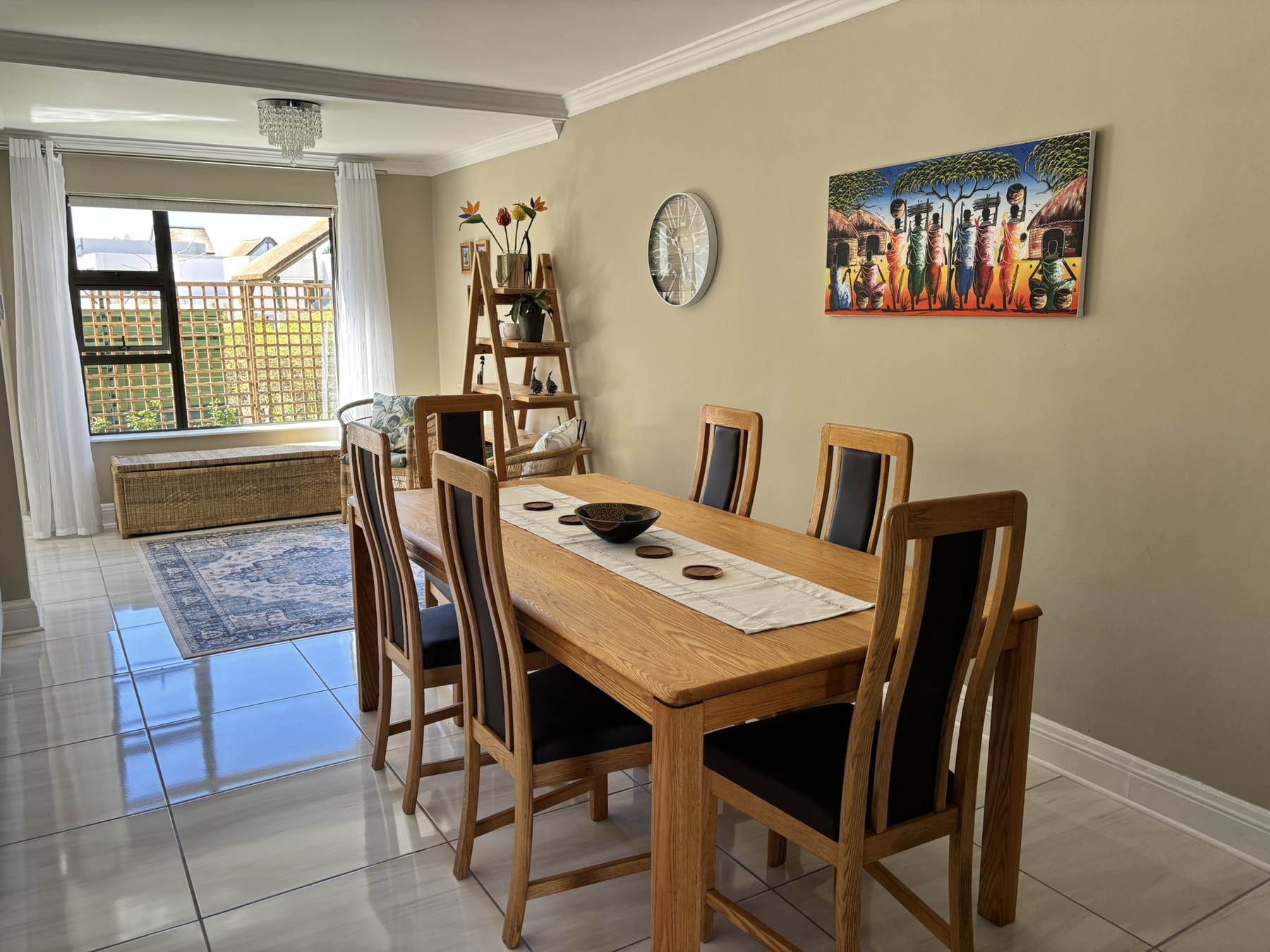 Dining area with wooden table and seating for six