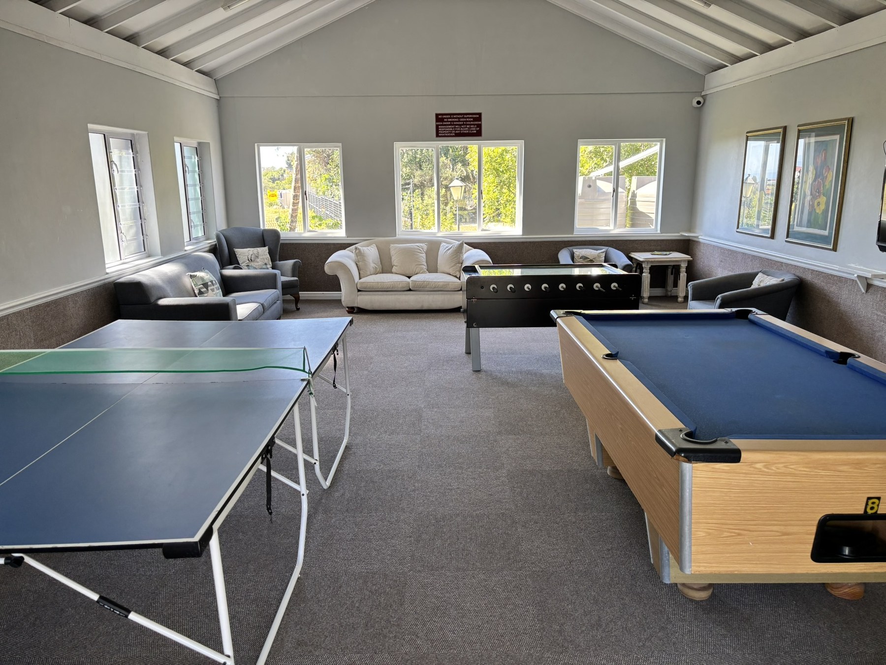 Games room with table tennis, pool table and foosball
