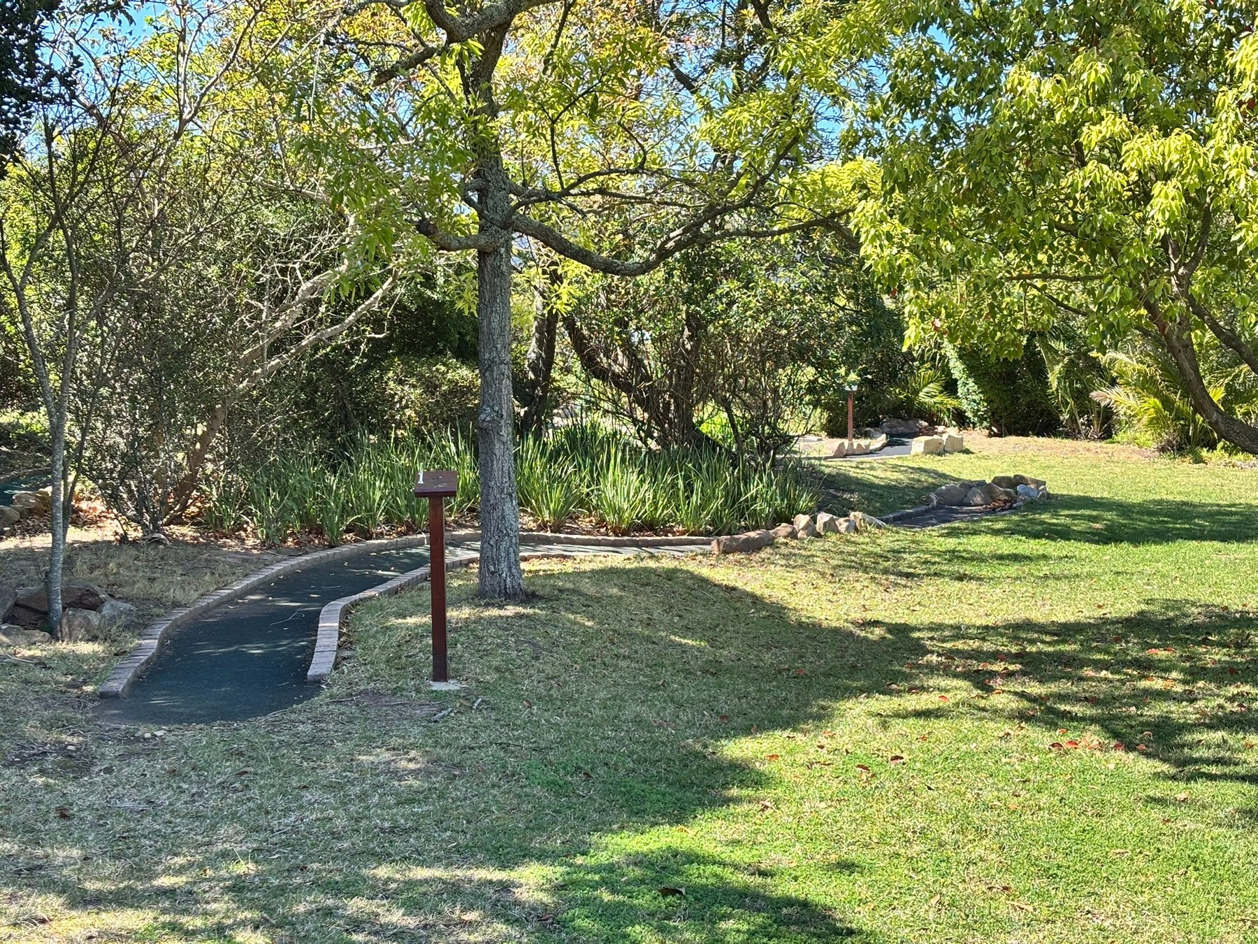 Mini golf course set among landscaped gardens